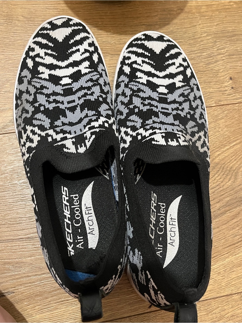SkechersBlack & White Slip-On Knit Sneakers